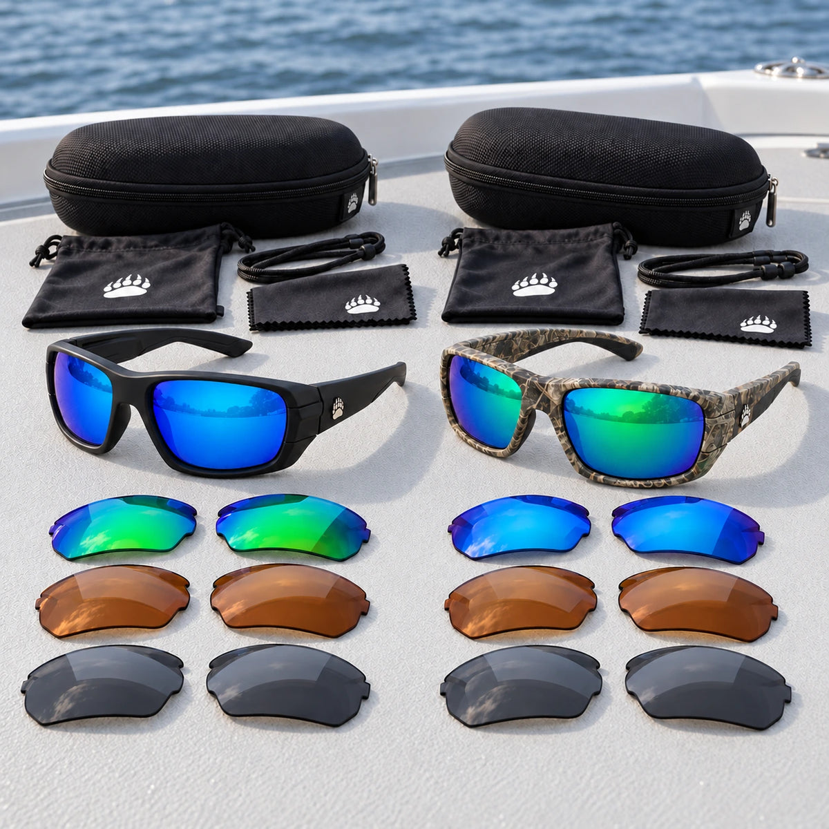 Black and camo Grizzly Pro sunglasses kits with interchangeable lenses and accessories on a boat deck.